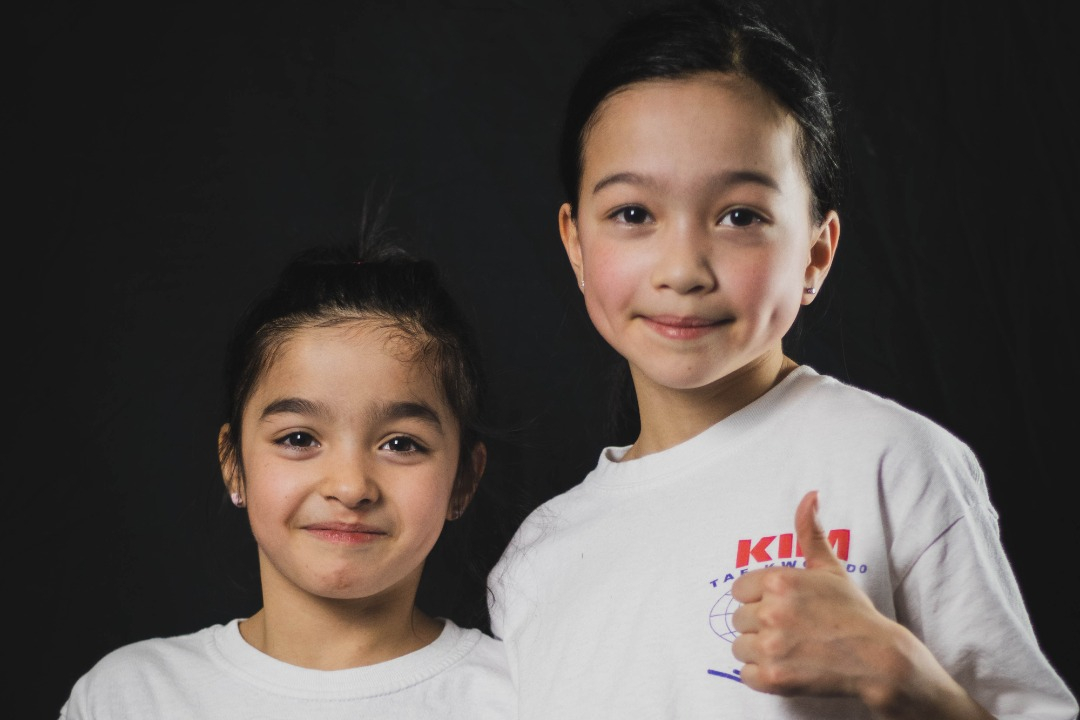 Two children in the Children Class at Kim's Taekwondo center in Montreal