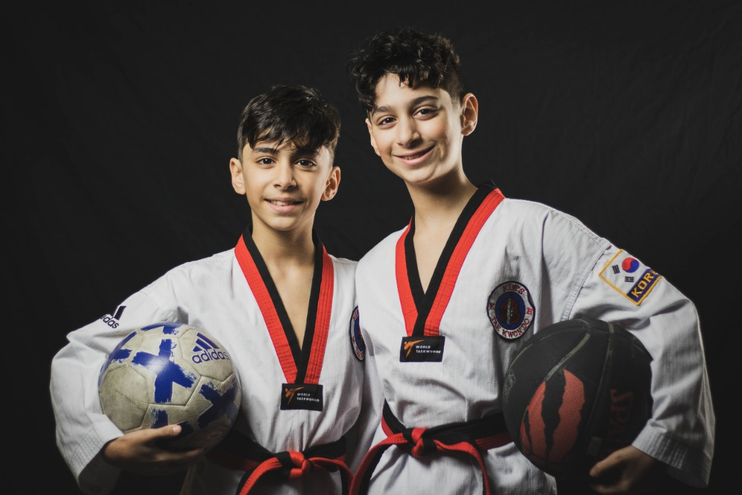 Two young adults in the Summer Camp program at Kim's Taekwondo center in Montreal