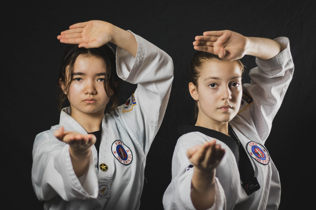 Two young adults in the Taekwondo demonstration team at Kim's Taekwondo center in Montreal