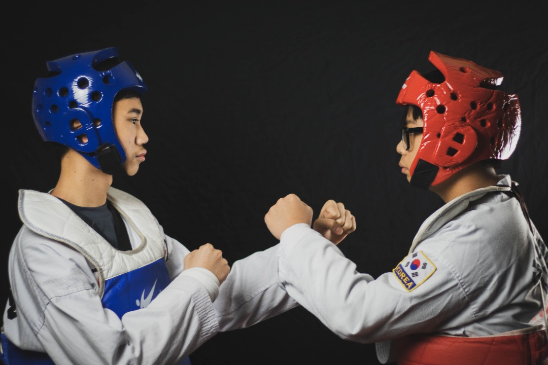 Two kids in the Taekwondo Sparring team at Kim's Taekwondo center in Montreal